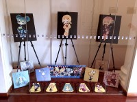 Gallery outside with putidevil and Y-Oji illustrations.