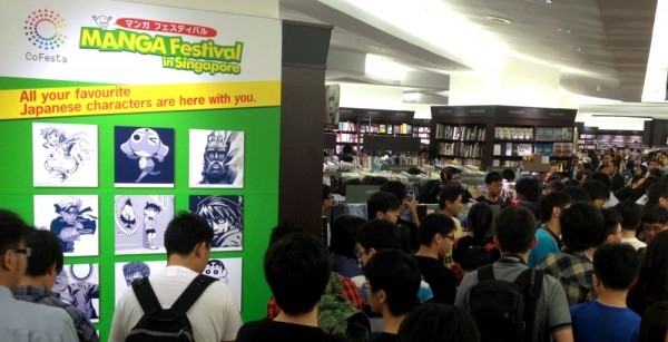 A giant crowd congregates, waiting for the presentation to start.